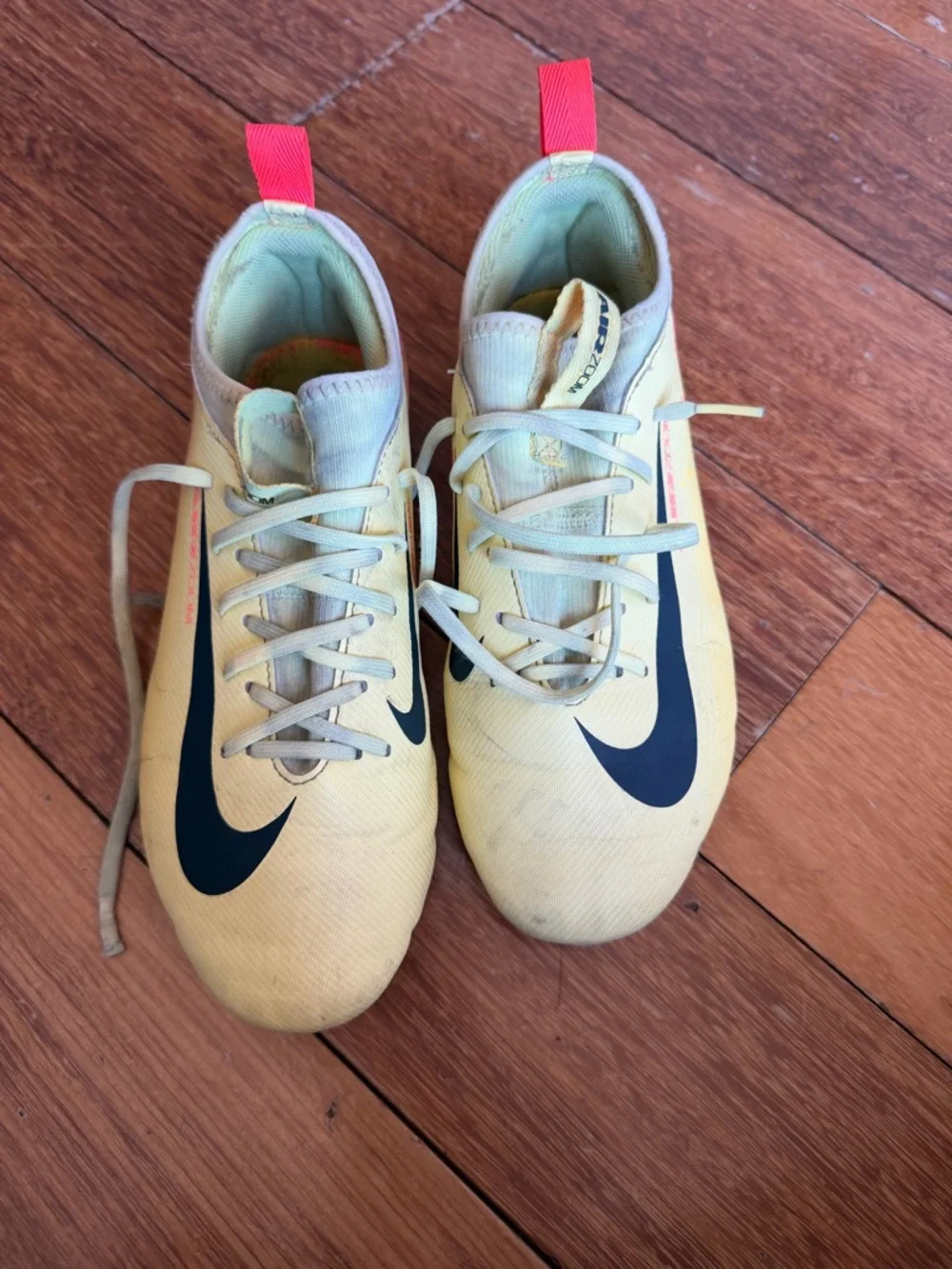 Nike Yellow Soccer Cleats with Black Swoosh and Accents